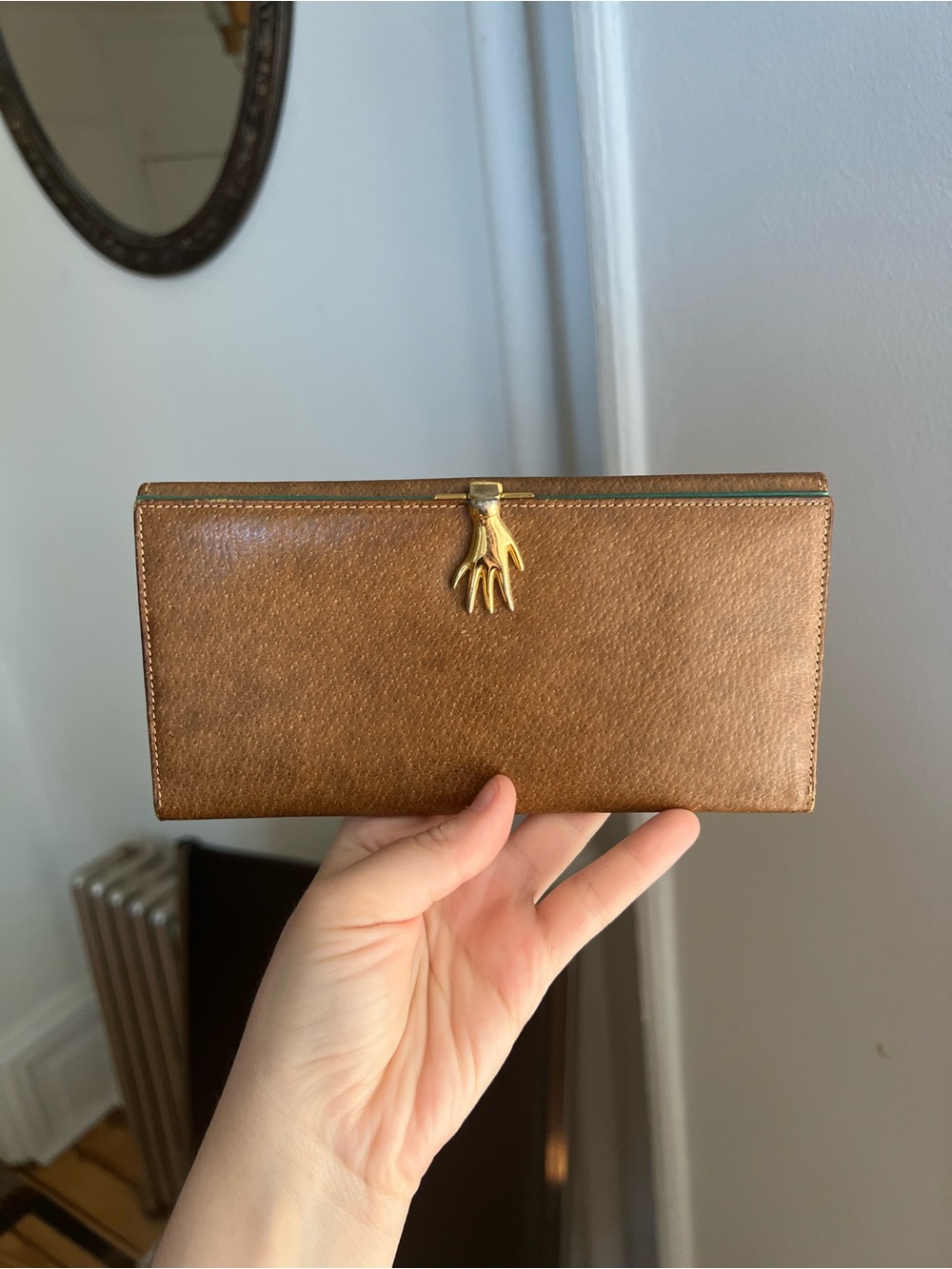 Gucci extremely RARE vintage wallet with golden hand clasp motif.